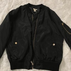 black bomber jacket with gold detailing
